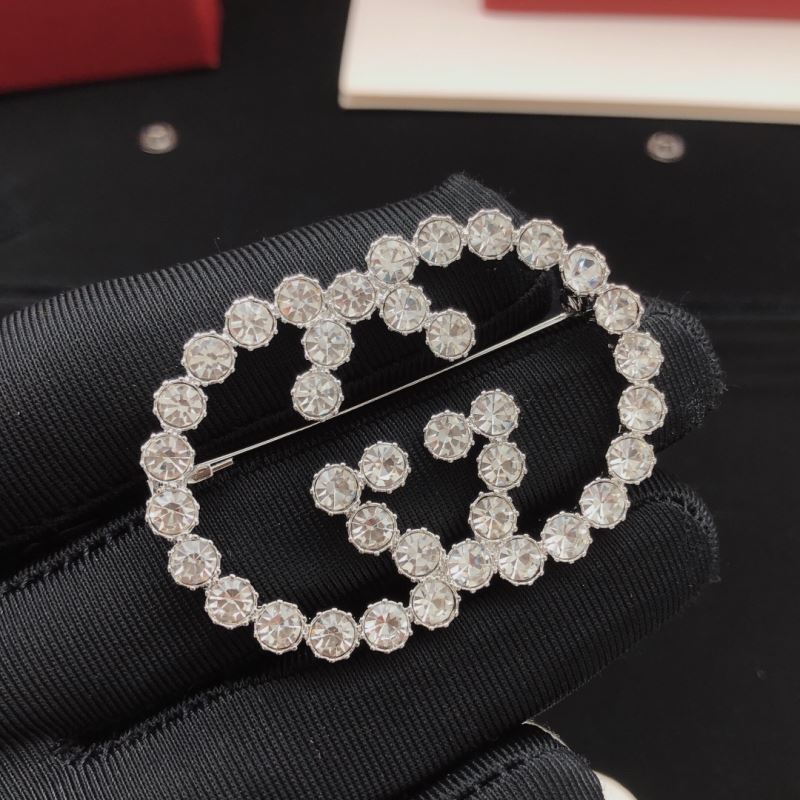 Gvc*1 brooches